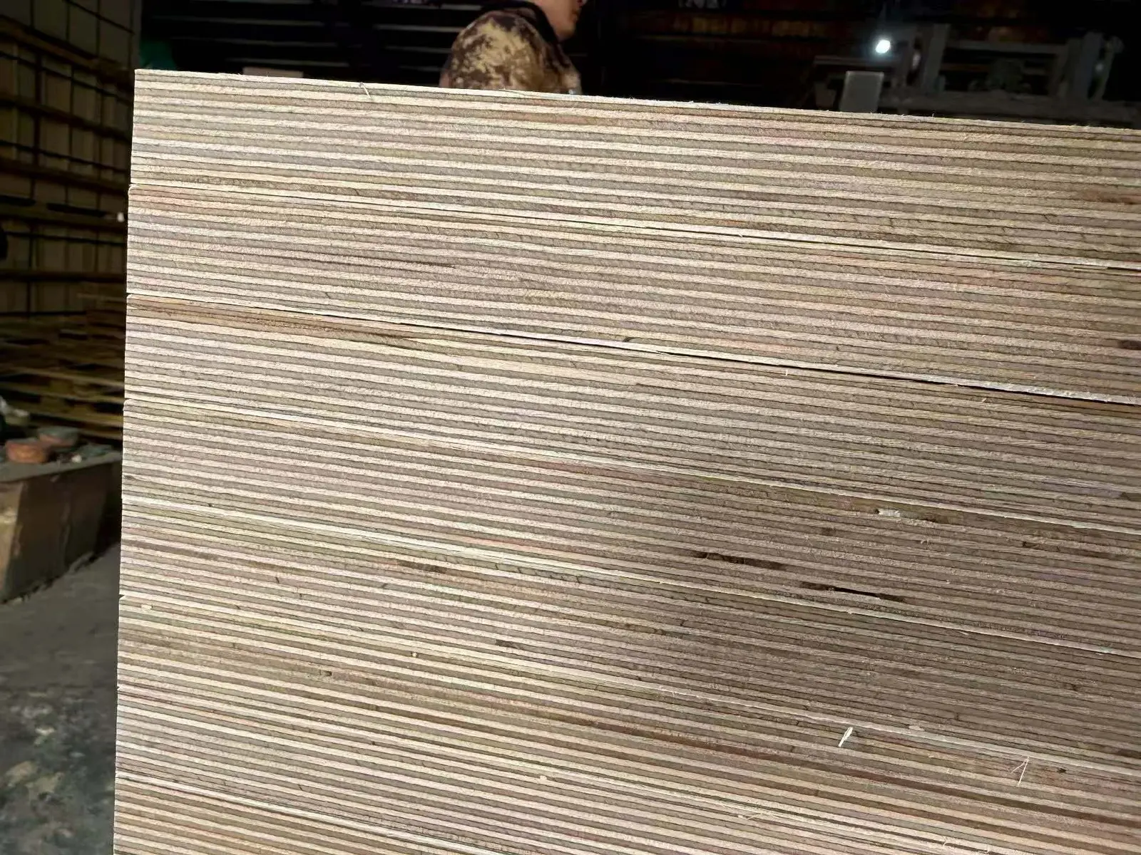 Full-size birch plywood panels stacked during production